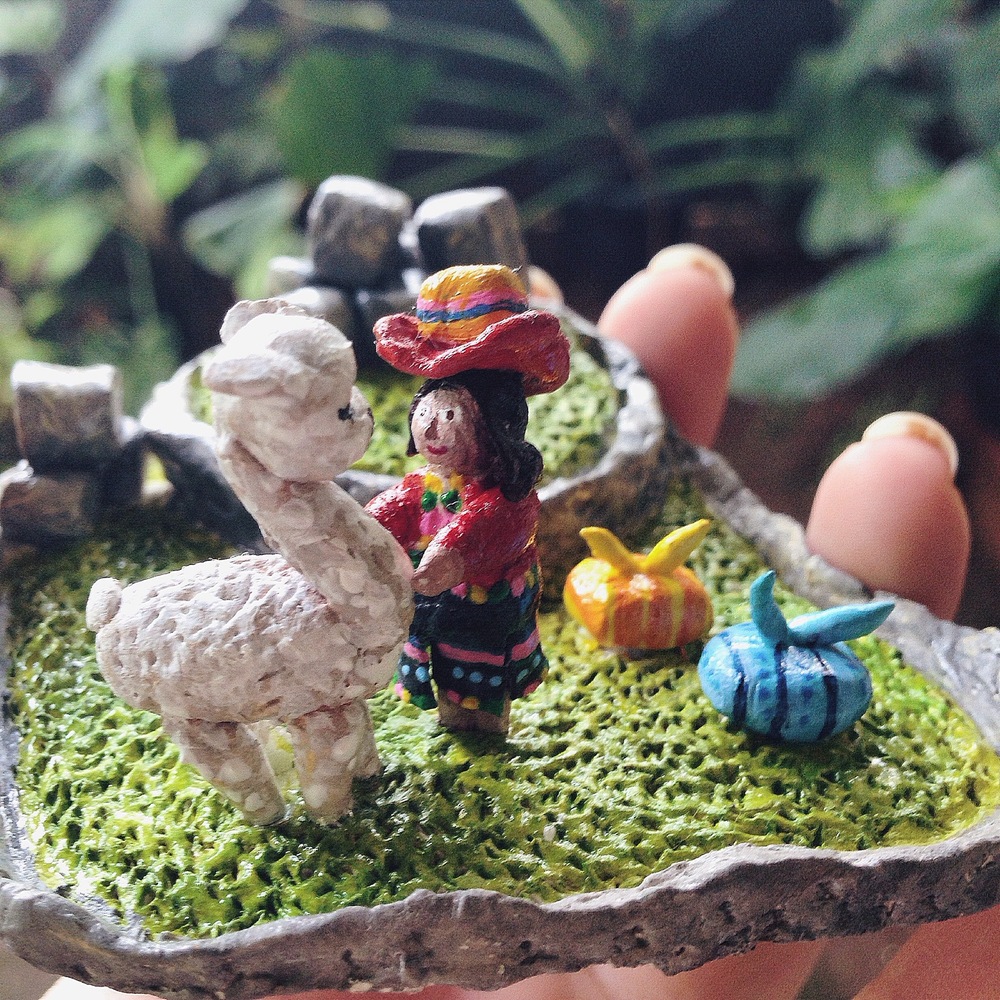 michelleflorida - Daily Life in Machu Picchu A daily scene of a Peruvian girl with her lovely llama, surrounded by stones in Machu Picchu. Clay, finished with acrylic paint. 2014.